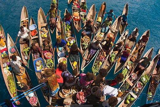 Local villagers bring produce to a floating market